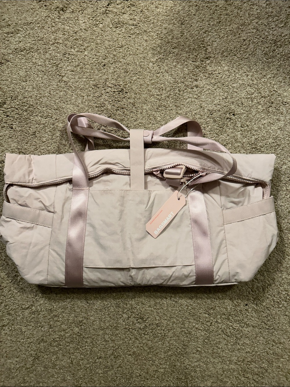 Lightweight Travel Tote. New with tags. Comes in your choice of pink or cream.